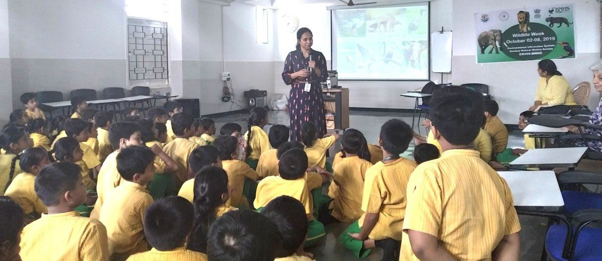 Ms. Sushmita Karmakar conducting session at Shishuvan School with the eco-friendly banner in the background